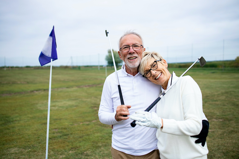 two seniors on golf course