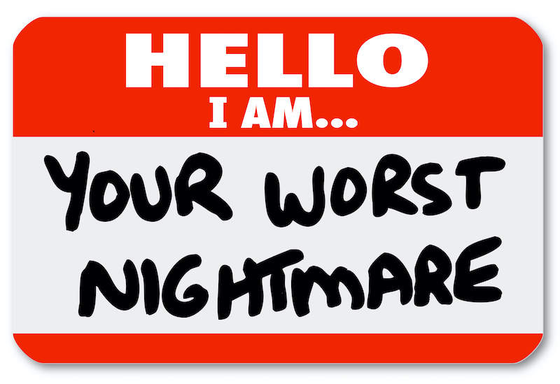 A red nametag sticker with words Hello I Am Your Worst Nightmare that might be worn by a dissatisfied, angry customer or someone complaining or being cranky