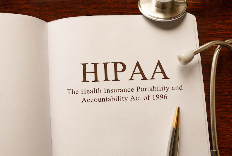 Page with HIPAA (The Health Insurance Portability and Accountability Act of 1996) on the table with stethoscope, medical concept