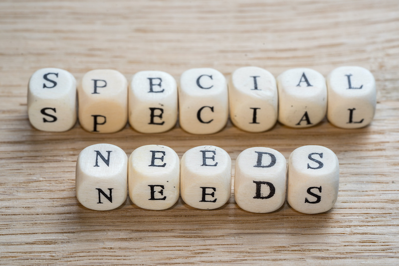 Special needs text on a wooden cubes on a wooden background