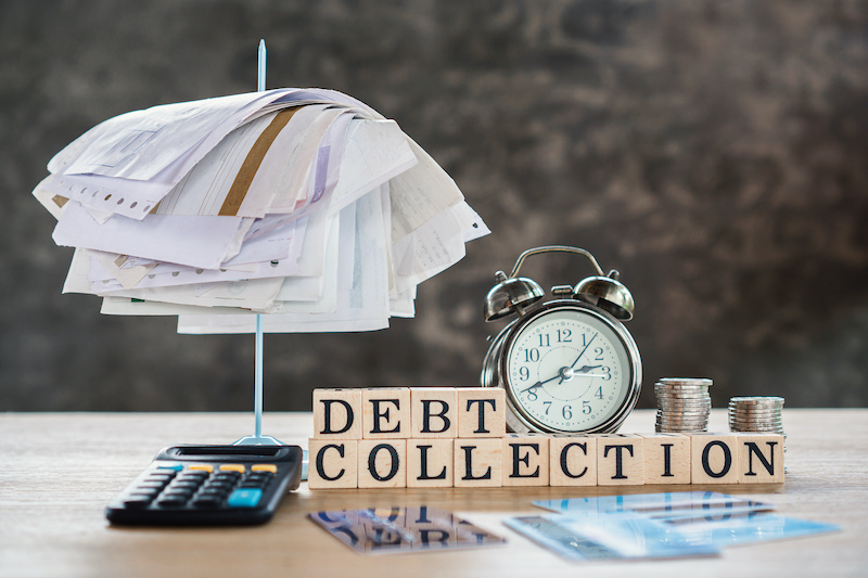 debt collection stack of bills upland california