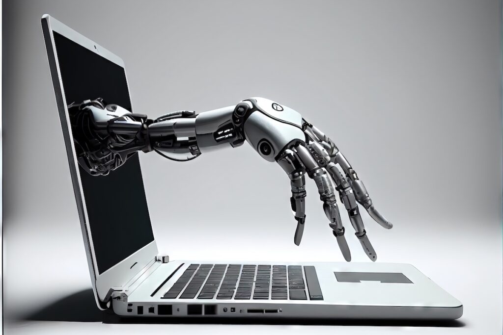 Robotic hand reaching out of laptop screen to begin typing generative AI writing work. Bloggers and ghostwriters are being supplemented by technology