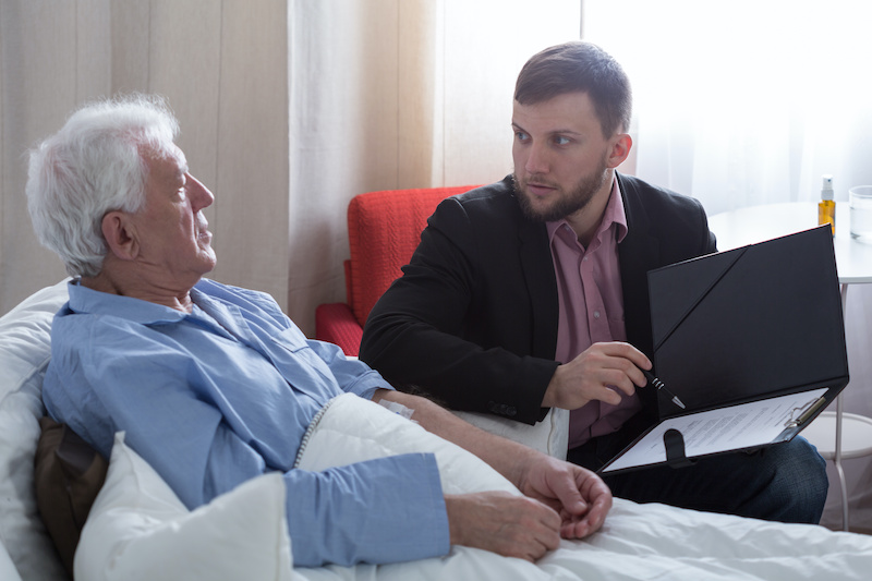 Terminal patient talking with notary about his last will