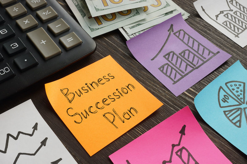 Business Succession Plan is shown on a business photo using the text