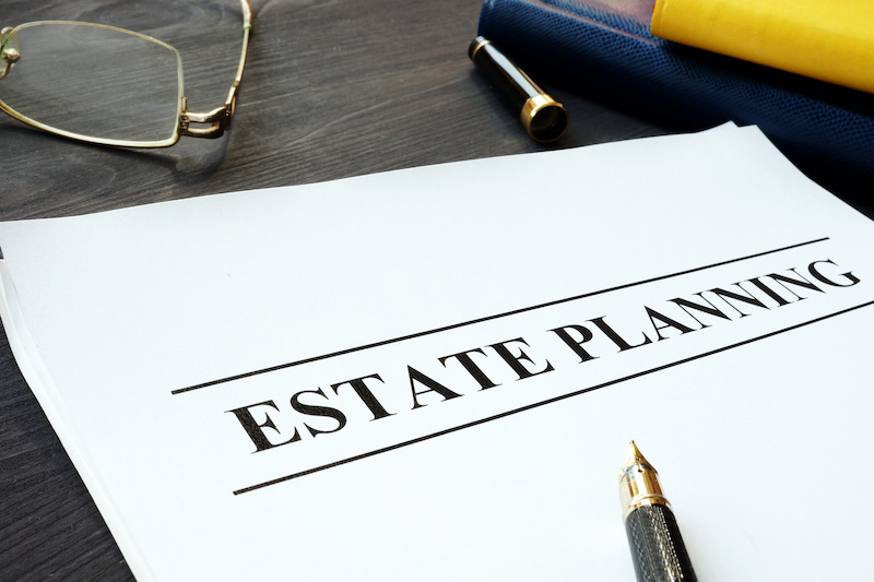 Estate planning documents and pen on a table.