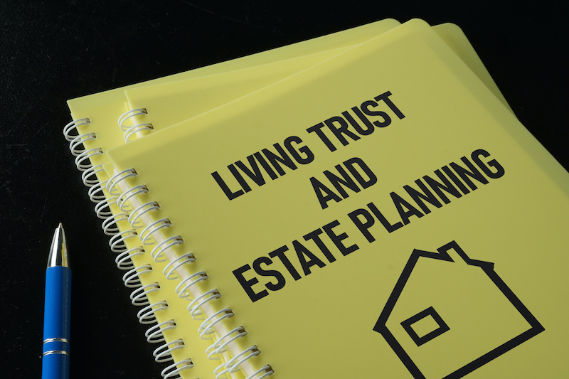 Living trust and estate planning is shown on a conceptual business photo