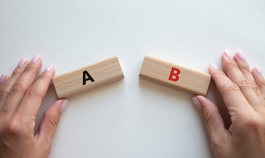 Plan A and Plan B symbol. Concept word Plan A and Plan B on wooden blocks. Businessman hand. Beautiful white background. Plan A and Plan B concept. Copy space