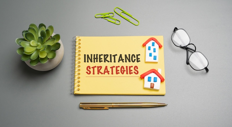 Inheritance strategies are plans to transfer wealth efficiently, reduce taxes, avoid probate, and ensure assets go to intended heirs according to your wishes. Notes with words and houses