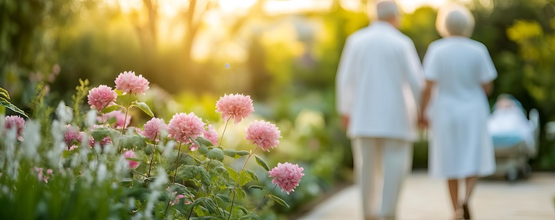 Elderly couple visiting a loved one in the hospital garden, family, outdoor space