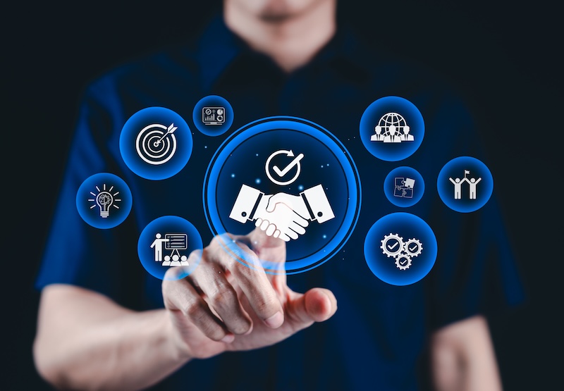 Trusted partnership and business collaboration concept. Businessman interact with digital handshake icons, represent trust, teamwork, successful collaboration in corporate partnerships, trustworthy,