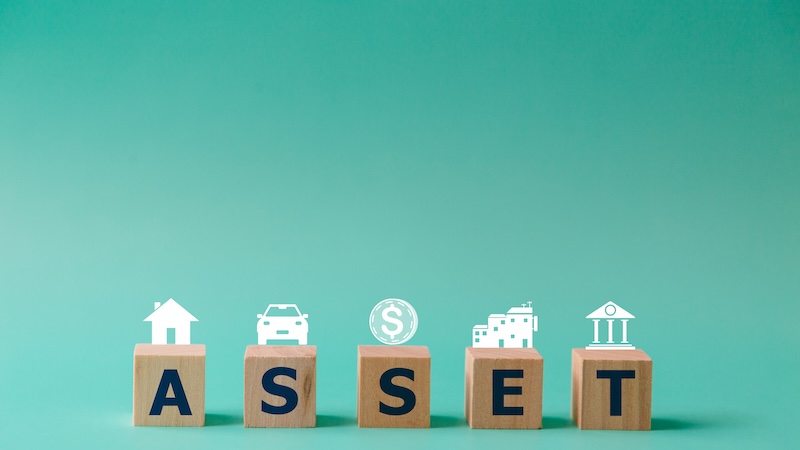 Wooden cubes with assets icon on background, Asset management and financial accounting, House and property investment and asset management, Interest rates, Loan mortgage