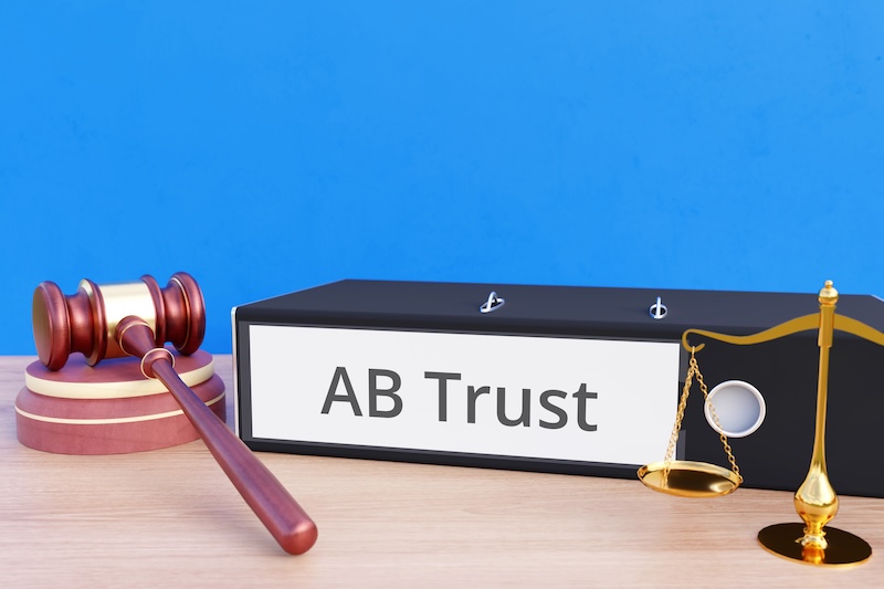 AB Trust – Folder with labeling, gavel and libra – law, judgement, lawyer income tax basis