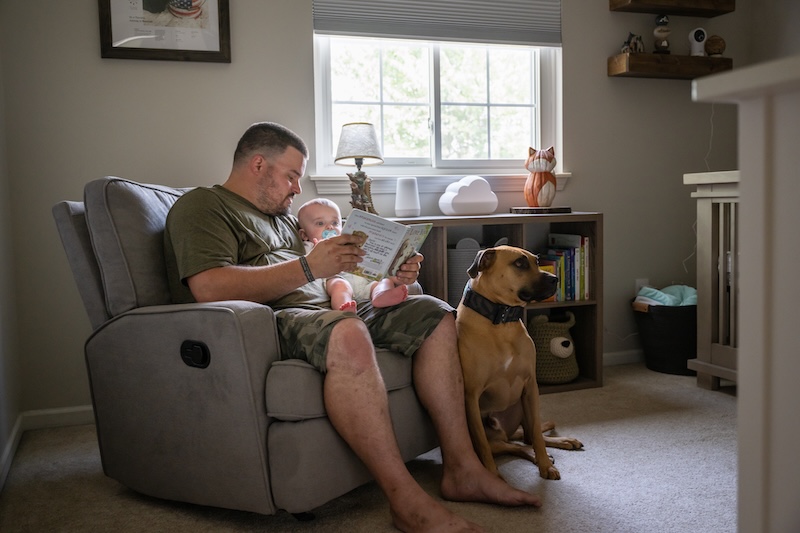 Marine veteran with service dog and family living life.