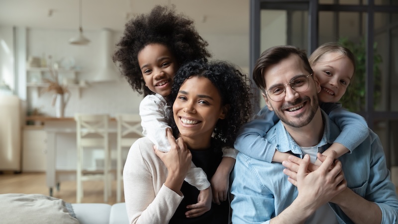 Portrait of happy multiracial couple enjoying sweet family moment with adorable little mixed raced daughters at home. Smiling cute small stepsisters cuddling cheerful parents, looking at camera. SSUCv3H4sIAAAAAAAACoxT3WoUMRR+lZo7YSPJ/CZ7q2/RLSV/sxs7MxlmMlpZFmqvBIV6KSKCPoAUpSDY+gyZN/JktqVYvPBiMifnfOc7v9kiKQar0HKLbF2Pg++Ft65FS7JAvWm16WfRaOtdb0U936TwatOKxqBlO9b1boEGL/w4mAF44KaEN2uAz/e7AIfbqEdLhAA+yijsFv/QHS2QWJtWvYq+ohYNCIcoVUXBmJC4KpXCmaoIZkVhMKcULCYhsiJA8l8wiCDtevBOnXQb513kB9+nrmnG1qp9AwCkeyOawdtY54ygSTKfabQOm9F70880d3aGjnZQf29qI+ZuHCJmIImkVJjRkuNMlxLLPE1xATSQjMolK8GVmCpNeJJiknNIPCsqLAx4UV1kNM3KytAYOytLVulKYKKIwRnjFDMuCaaMMF7KRGYqtqEQSjHFE6wLA0GlToFNccwTQQtCjCI8wqislMmJxhAA2MCIhdYSC5UzTTRNMpXFUk9eQqHN7XDFqC20bIteOCVqUKag7HqrbLveI5zfxLWB2bqx9T3MLzandq4TsoZeVuBmFmgjhgEA+lYR9wb2zzV7ktb52MDoqWGdQKJpkmVZTnKYKOU8TzJ0t3gbC44xUPScJ2L1bboW+BGpOFeMGlzmuoK2JbAWqShxoUoiFS9EWjEgG7vaCR0XYvtgvPTvbYCr0E6aeytMs69m6cFqUfA0nRusnxWQFWiUaB9gOtfqfG9ztRt76U73YfYPICLsqRez1LjhngxKrFzfzK+oFwOkPPcaRtMJvwHls+Vq9eggfAlfw+fwMXxYrcLn6Sz8DD/guwmX4df0drVKSEL25zFJj8OncDmdTeerFX98EN6H7wC9nM7D7+nsYHodrsL19G66iOJ1uJreAMlNpJougPwbEMI/pU+ed2u0+wMAAP//AwBkh+jkYQQAAA==