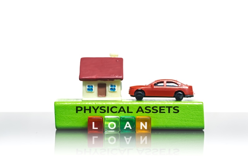 House and car representing physical assets for a loan on a white background
