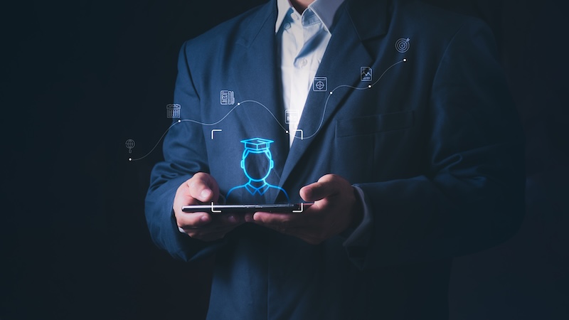Professional businessman using a smartphone for online education and career planning with virtual, Concept of E-learning, digital graduation, skills development, and success in professional life.